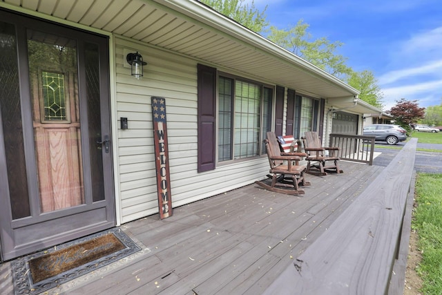 wooden terrace featuring covered porch
