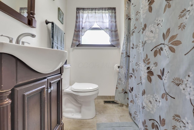 full bath featuring toilet, vanity, tile patterned floors, and a shower with shower curtain