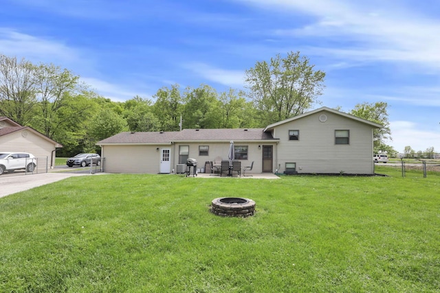 rear view of property with an outdoor fire pit