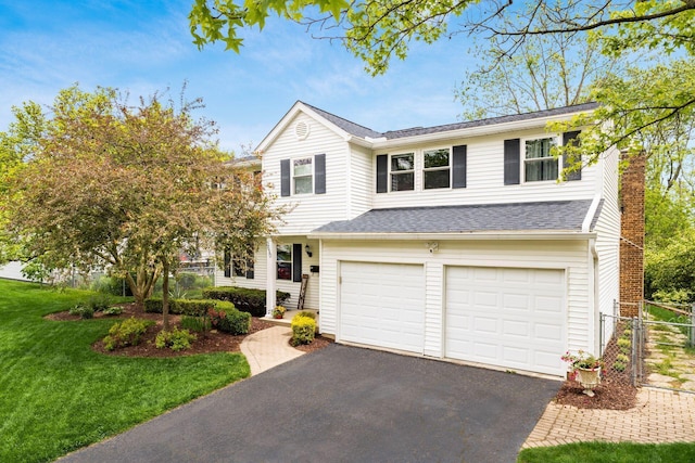 3690 Christopher Pl, Grove City, OH 43123 - traditional-style house featuring driveway, an attached garage, a shingled roof, and a chimney