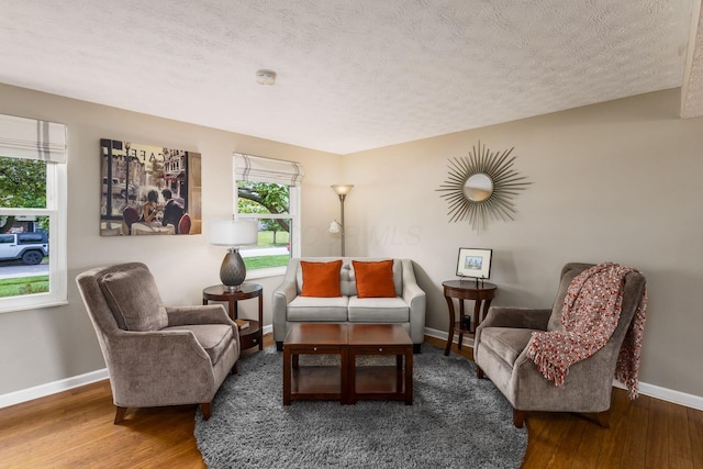 3690 Christopher Pl, Grove City, OH 43123 - living area featuring wood finished floors, baseboards, and a textured ceiling