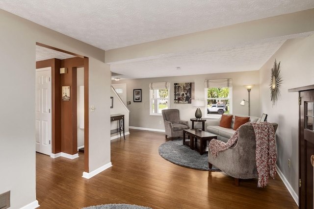 3690 Christopher Pl, Grove City, OH 43123 - living room with wood finished floors, a textured ceiling, and baseboards