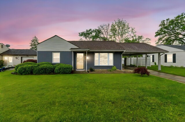 259 Merriman Dr, West Jefferson, OH 43162 - single story home with concrete driveway, a front lawn, an attached carport, and stucco siding