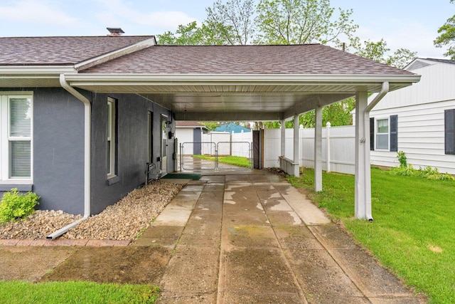 259 Merriman Dr, West Jefferson, OH 43162 - view of parking with a gate, concrete driveway, and an attached carport
