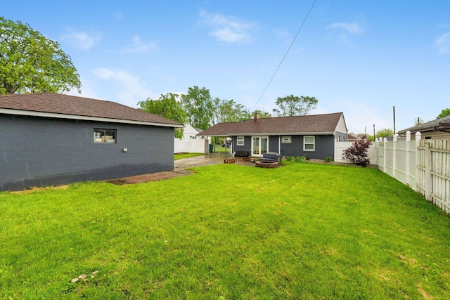 259 Merriman Dr, West Jefferson, OH 43162 - rear view of property with an outdoor fire pit and a patio area