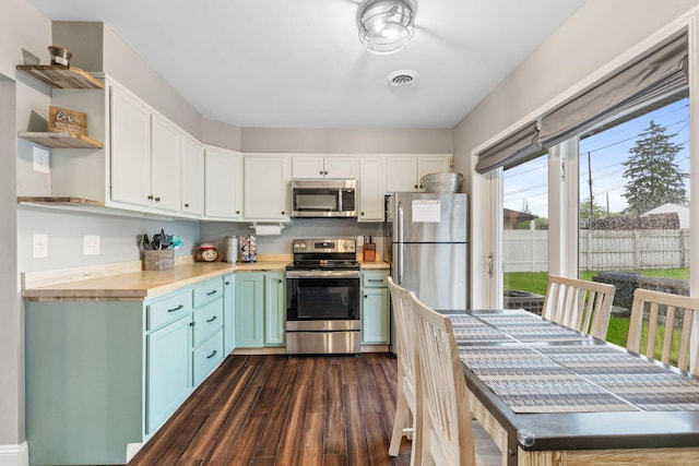 259 Merriman Dr, West Jefferson, OH 43162 - kitchen with appliances with stainless steel finishes, open shelves, dark wood-style flooring, white cabinets, and butcher block countertops