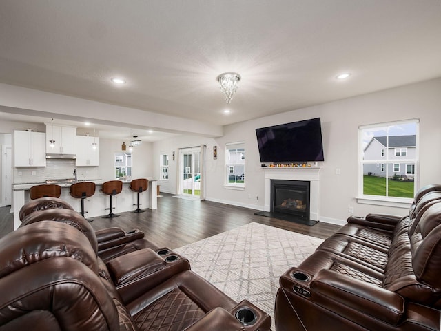 418 Amethyst Ct, Delaware, OH 43015 - living room with dark wood-style flooring, recessed lighting, baseboards, and a glass covered fireplace
