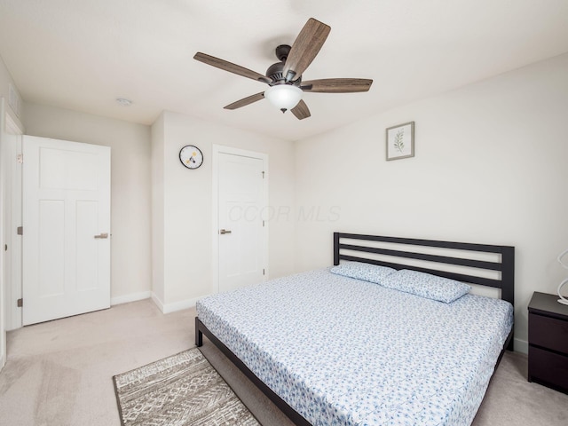 418 Amethyst Ct, Delaware, OH 43015 - bedroom with light colored carpet, baseboards, and a ceiling fan