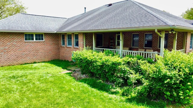 1320 Oakridge Dr, Bucyrus, OH 44820 - back of house with brick siding, a lawn, and a shingled roof