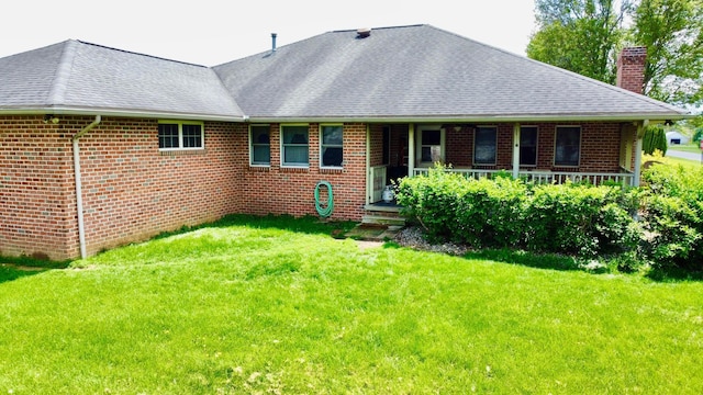 1320 Oakridge Dr, Bucyrus, OH 44820 - rear view of house with a chimney, a lawn, and brick siding