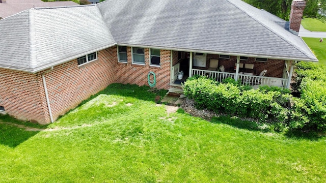 1320 Oakridge Dr, Bucyrus, OH 44820 - view of front of property with a chimney, a front lawn, brick siding, and roof with shingles