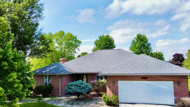 1320 Oakridge Dr, Bucyrus, OH 44820 - view of front of house featuring roof with shingles, brick siding, and an attached garage