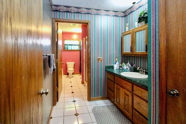 1320 Oakridge Dr, Bucyrus, OH 44820 - bathroom with tile patterned flooring, wallpapered walls, toilet, vanity, and a shower