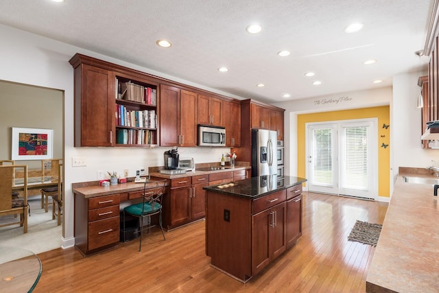 6227 Marias Point Ln, Columbus, OH 43213 - kitchen with stainless steel appliances, open shelves, light wood-type flooring, a sink, and recessed lighting