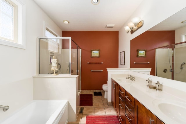 6227 Marias Point Ln, Columbus, OH 43213 - bathroom featuring a stall shower, toilet, tile patterned floors, double vanity, and a garden tub