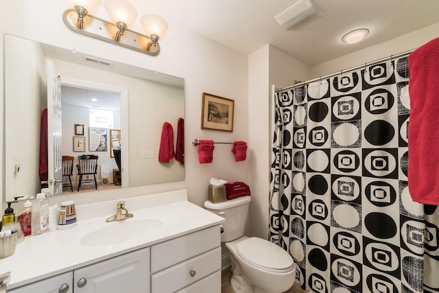 6227 Marias Point Ln, Columbus, OH 43213 - bathroom with vanity, toilet, a textured ceiling, and a shower with curtain