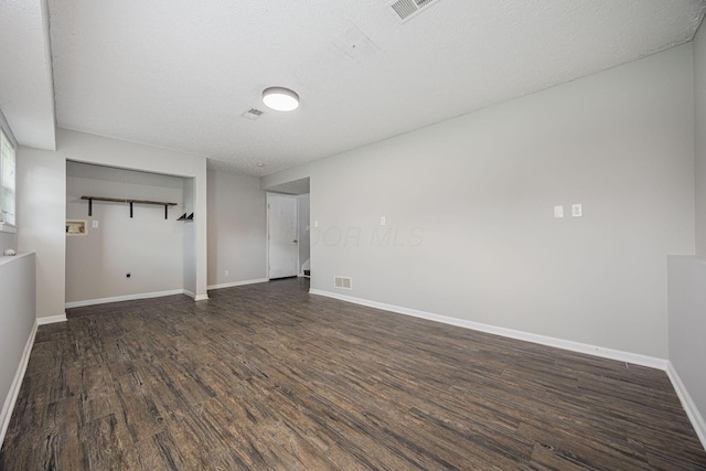 9721 State Rte 521, Sunbury, OH 43074 - unfurnished room with dark wood-style floors, baseboards, and a textured ceiling