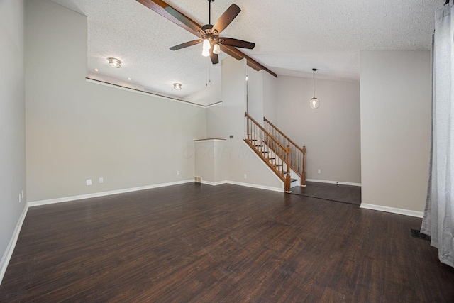9721 State Rte 521, Sunbury, OH 43074 - unfurnished living room with lofted ceiling, a textured ceiling, wood finished floors, ceiling fan, and baseboards