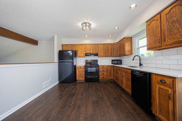 9721 State Rte 521, Sunbury, OH 43074 - kitchen with black appliances, a sink, brown cabinetry, dark wood-type flooring, and a textured ceiling