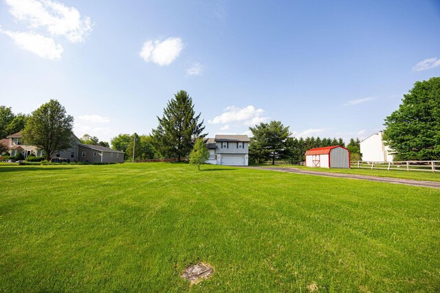9721 State Rte 521, Sunbury, OH 43074 - view of yard featuring an outdoor structure, a storage unit, and a detached garage