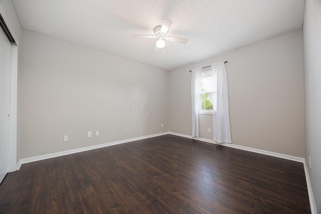 9721 State Rte 521, Sunbury, OH 43074 - spare room with a ceiling fan, dark wood finished floors, baseboards, and a textured ceiling