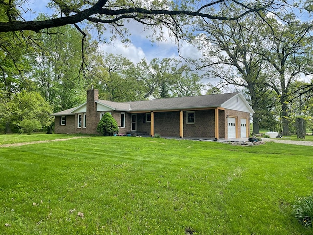 2814 Nesbitt Rd, Caledonia, OH 43314 - single story home with brick siding, a garage, a front lawn, and a chimney
