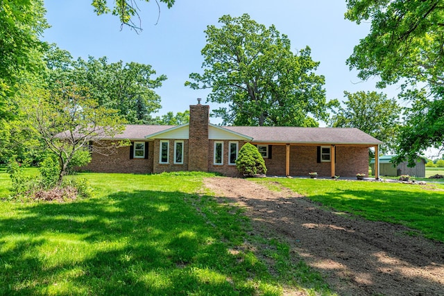 2814 Nesbitt Rd, Caledonia, OH 43314 - rear view of property with a chimney, a yard, and brick siding