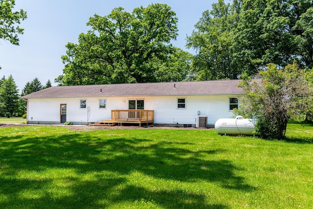 2814 Nesbitt Rd, Caledonia, OH 43314 - back of property with a wooden deck, a yard, and central air condition unit