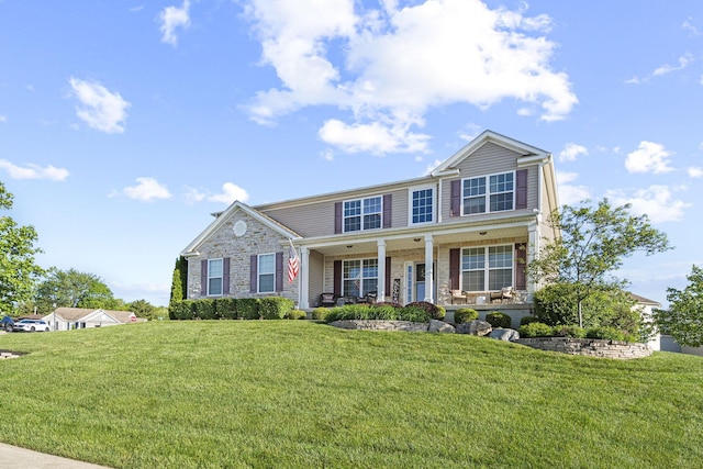 607 Green Forest Pl, Lithopolis, OH 43136 - view of front of house with covered porch, a front lawn, and stone siding