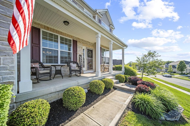 607 Green Forest Pl, Lithopolis, OH 43136 - property entrance featuring covered porch and stone siding