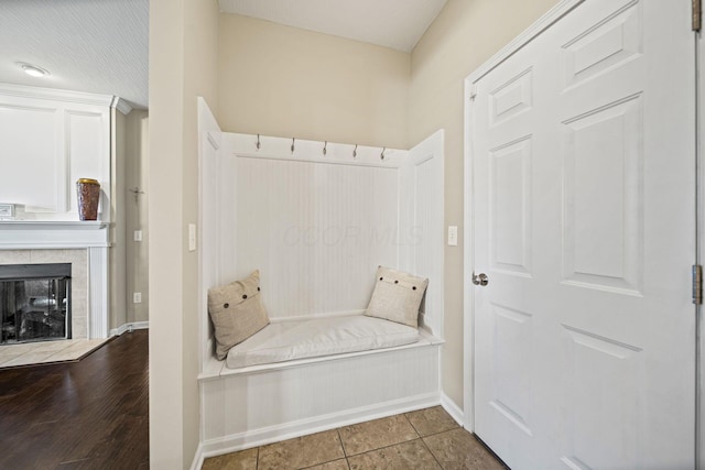 607 Green Forest Pl, Lithopolis, OH 43136 - mudroom with baseboards, a tiled fireplace, and tile patterned flooring