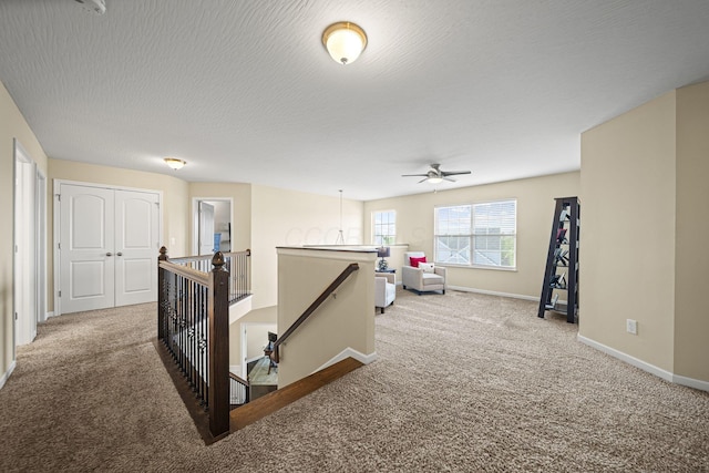 607 Green Forest Pl, Lithopolis, OH 43136 - corridor featuring an upstairs landing, carpet flooring, and baseboards