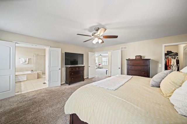 607 Green Forest Pl, Lithopolis, OH 43136 - carpeted bedroom featuring a spacious closet, a closet, ceiling fan, ensuite bath, and baseboards