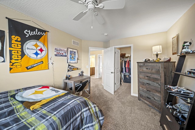 607 Green Forest Pl, Lithopolis, OH 43136 - bedroom featuring carpet, a walk in closet, a ceiling fan, a closet, and baseboards