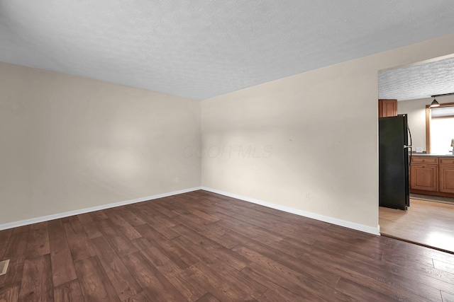 1235 Belle Meade Pl, Westerville, OH 43081 - unfurnished room featuring wood finished floors, baseboards, and a textured ceiling
