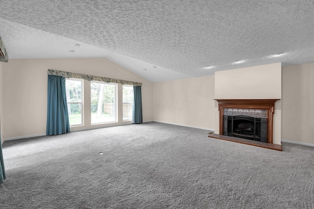 1235 Belle Meade Pl, Westerville, OH 43081 - unfurnished living room featuring lofted ceiling, a tile fireplace, carpet floors, baseboards, and a textured ceiling