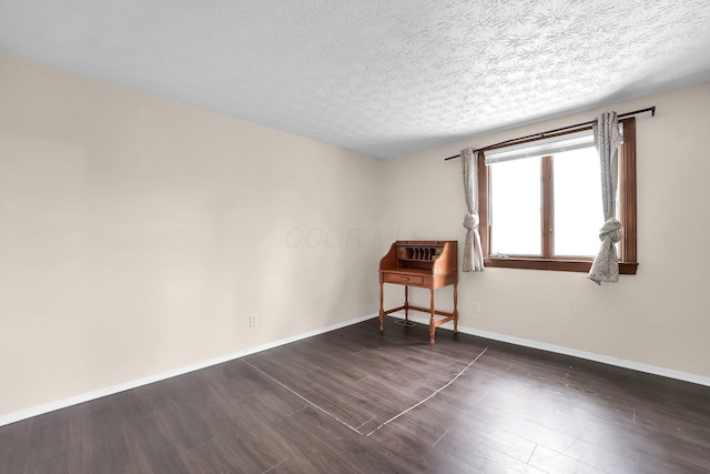1235 Belle Meade Pl, Westerville, OH 43081 - unfurnished room with wood finished floors, baseboards, and a textured ceiling