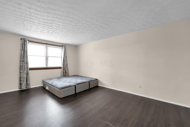 1235 Belle Meade Pl, Westerville, OH 43081 - bedroom featuring wood finished floors, a textured ceiling, and baseboards