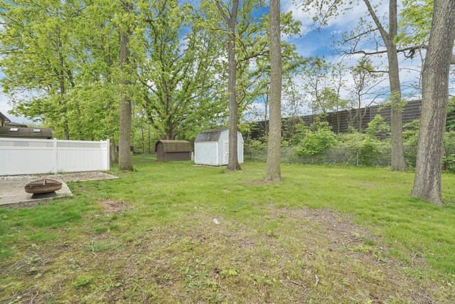 1235 Belle Meade Pl, Westerville, OH 43081 - view of yard with a shed, an outdoor fire pit, and an outdoor structure