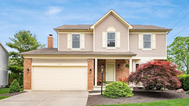 832 Mcleod Parc, Pickerington, OH 43147 - traditional home with driveway, brick siding, and a chimney