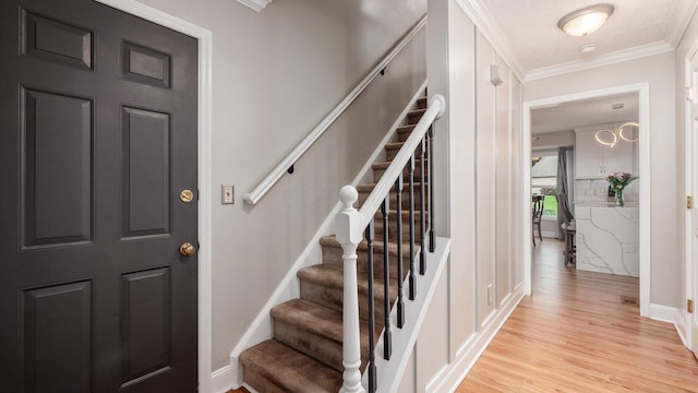 832 Mcleod Parc, Pickerington, OH 43147 - entrance foyer with light wood-type flooring, ornamental molding, stairway, and baseboards