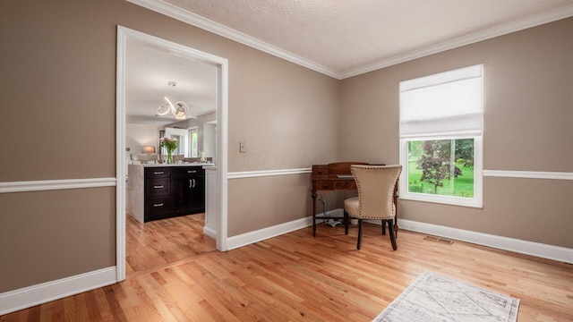 832 Mcleod Parc, Pickerington, OH 43147 - living area featuring light wood finished floors, ornamental molding, baseboards, and a textured ceiling