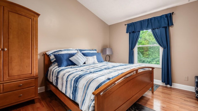 832 Mcleod Parc, Pickerington, OH 43147 - bedroom with lofted ceiling, wood finished floors, and baseboards