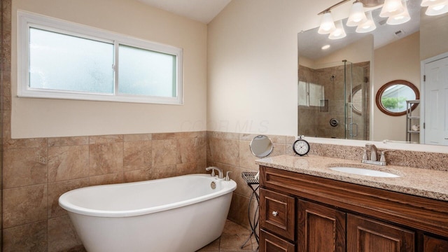 832 Mcleod Parc, Pickerington, OH 43147 - full bath with a shower stall, tile walls, vanity, a freestanding bath, and wainscoting