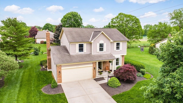 832 Mcleod Parc, Pickerington, OH 43147 - traditional-style home with brick siding, a shingled roof, driveway, a front lawn, and an attached garage