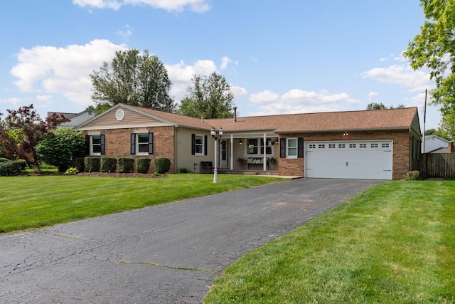 6235 George Fox Dr, Galloway, OH 43119 - ranch-style house featuring brick siding, a garage, and driveway