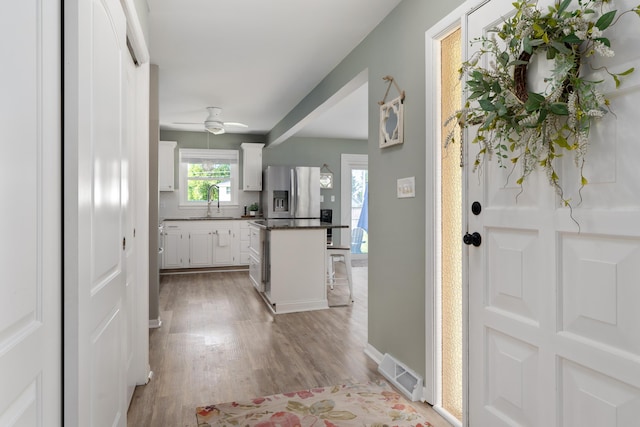 6235 George Fox Dr, Galloway, OH 43119 - entrance foyer with light wood finished floors and ceiling fan