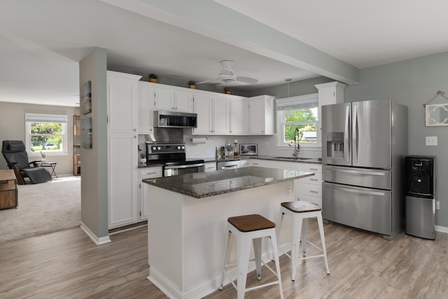 6235 George Fox Dr, Galloway, OH 43119 - kitchen featuring stainless steel appliances, plenty of natural light, and white cabinets