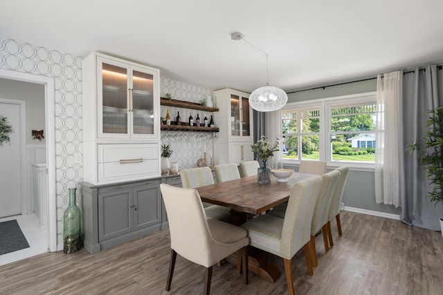 6235 George Fox Dr, Galloway, OH 43119 - dining space featuring wallpapered walls, a chandelier, and wood finished floors