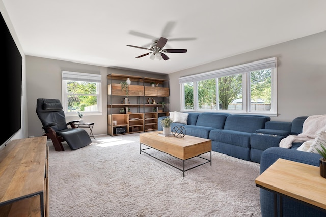 6235 George Fox Dr, Galloway, OH 43119 - carpeted living area with healthy amount of natural light and ceiling fan